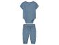 Baby set: romper en broek van blauwe mousseline.