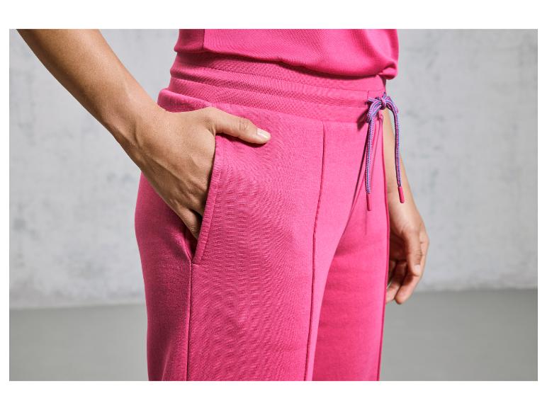 Roze sweatpants met trekkoord en zakken.