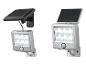 Twee op zonne-energie werkende LED-wandlampen met bewegingssensor.