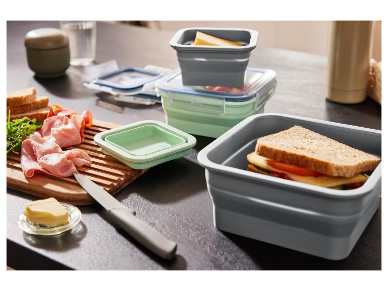 Opvouwbare lunchboxen, sandwich, vleeswaren en kaas.