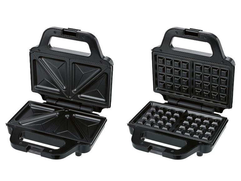 Open zwart tosti- en wafelijzer met verwisselbare platen.