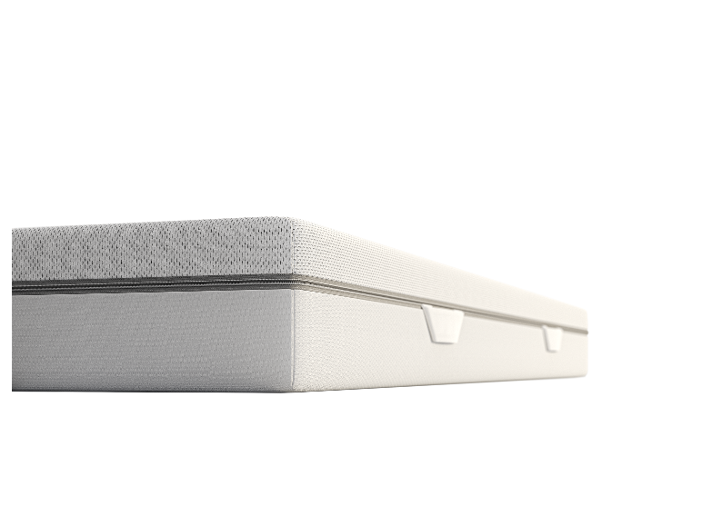 Een close-up van een wit en grijs matras.