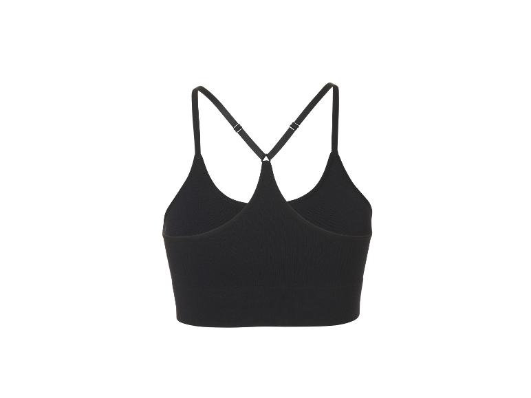 Zwarte geribbelde sporttop met gekruiste bandjes op de rug.