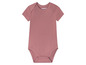 Een roze baby romper van Lupilu