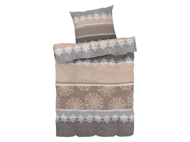 Beige dekbedovertrek met sneeuwvlokkenpatroon.