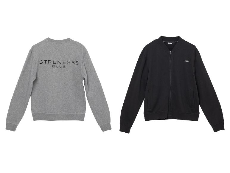 Grijze sweater met 'STRENESSE BLUE' tekst en zwart vest met rits.