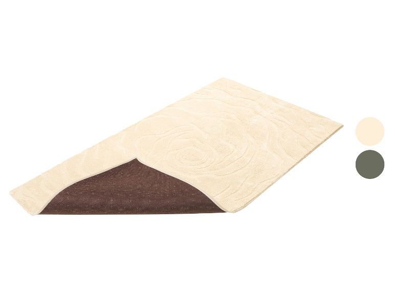 Beige badmat met golvend patroon en antislip onderkant.