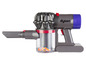 Een grijze Dyson stofzuiger met een doorzichtig stofreservoir.