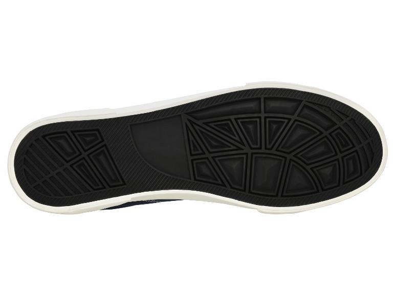 Zwarte sneakerzool met geometrische details en witte rand.