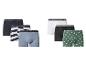 Verpakking van 6 heren katoenen boxershorts in zwart, wit, grijs, gestreept en groen met patroon.
