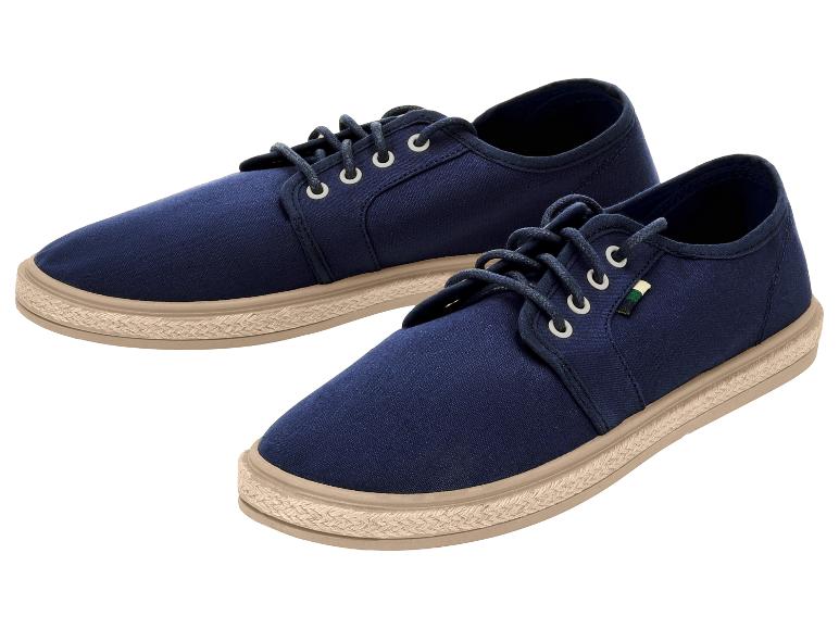 Paar donkerblauwe canvas veterschoenen met espadrillezool.