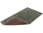 Grijze badmat met golvend patroon en antislip onderkant.
