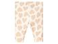 Witte leggings met roze hartjesprint.