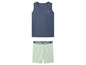 Een donkerblauw tanktop en lichtgroene shorts met 'Original Quality' erop.