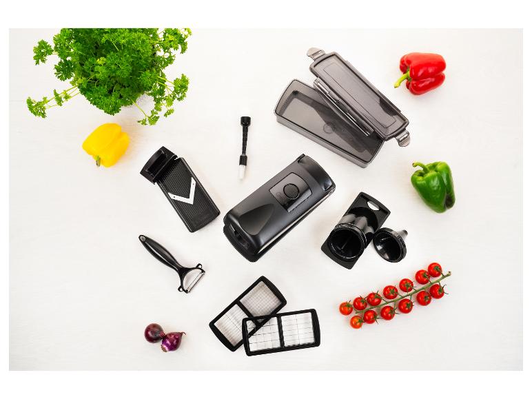 Genius keukenaccessoireset voor het snijden van groenten, met paprika's, tomaten en peterselie.