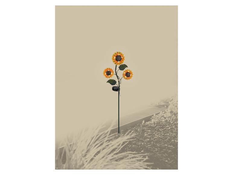 Zonnebloem-zonnelamp met drie bloemen, verlicht de tuin.