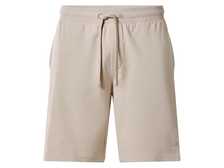 Beige sweatshorts met verstelbaar trekkoord en een klein geborduurd logo.