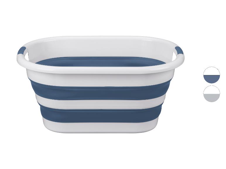 Opvouwbare wasmand in wit en blauw, met kleurstalen voor blauw en grijs.
