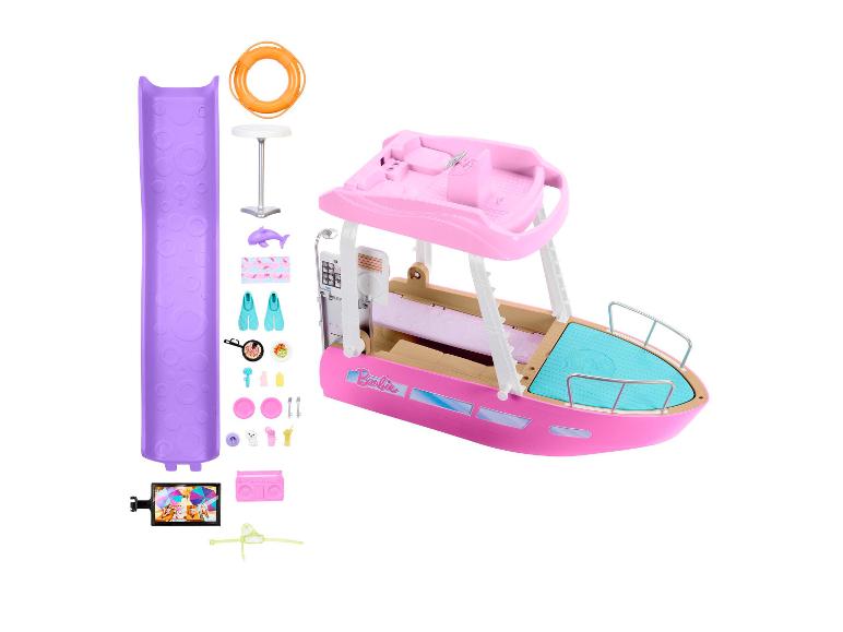 Barbie speelset met roze boot en strandaccessoires.