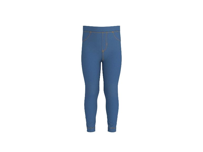 Blauwe jegging met oranje stiksels.