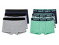 Vier boxershorts, waaronder een groene met 'Skate'-print.
