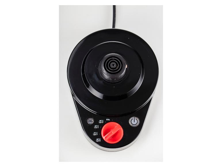 Bovenaanzicht van een zwarte waterkokerbasis met temperatuurregelaars en een rode knop.