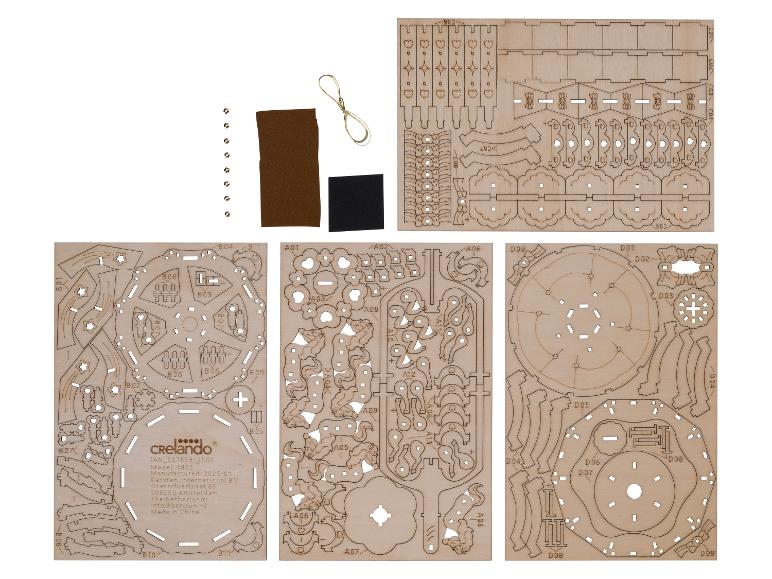 Crelado houten bouwset met lasergesneden onderdelen, accessoires en instructies.