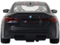 Achterkant van een zwarte speelgoedsportwagen met het opschrift M4 CSL.