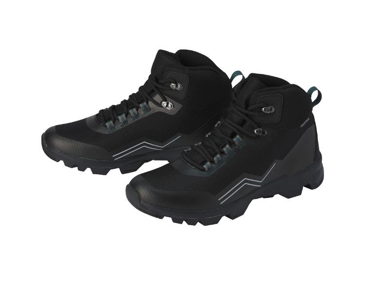 Twee zwarte wandelschoenen met veters.