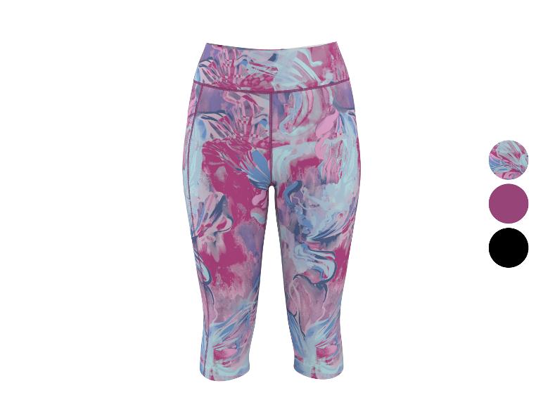 Dames capri legging met een levendig roze en blauw abstract bloemenpatroon.