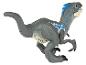 Een grijze plastic velociraptor speelgoedfiguur met blauwe details.