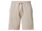 Beige sweatshorts met verstelbaar trekkoord en een klein geborduurd logo.