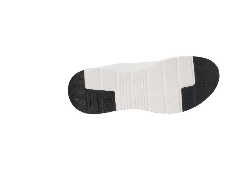 Witte en zwarte sportschoenzool met grip patroon.