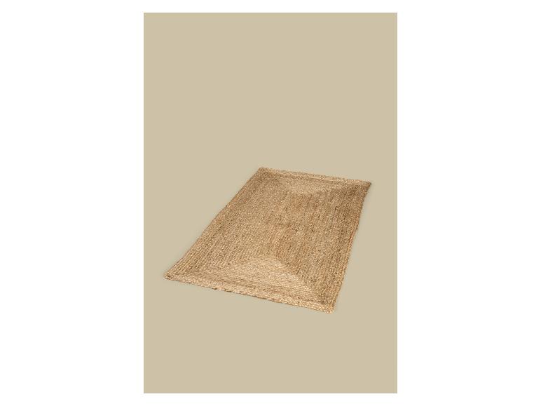 Rechthoekig vloerkleed van natuurlijk jute op een beige achtergrond.