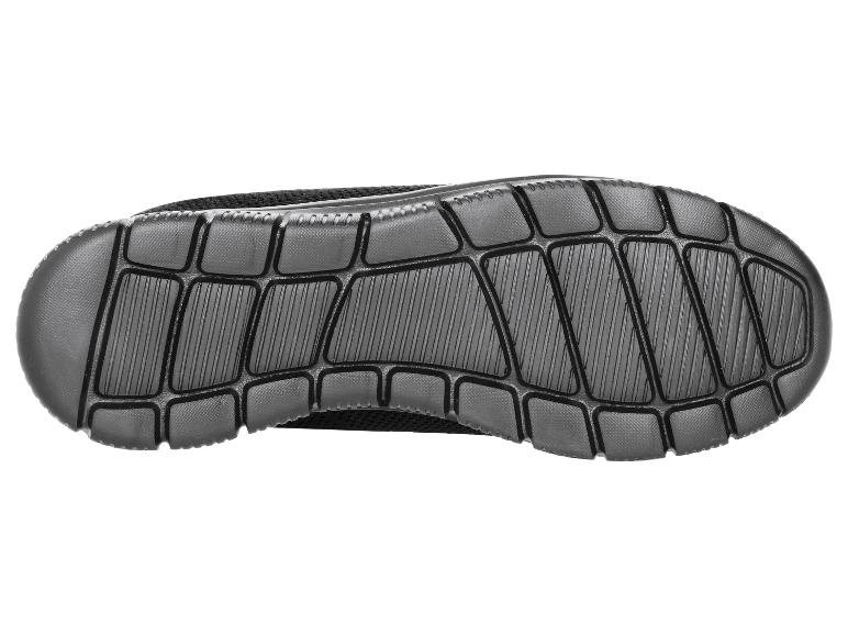 Zool van een zwarte sportschoen met gestructureerd patroon