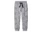 Grijze joggingbroek met zwart trekkoord en all-over dinosaurusprint.