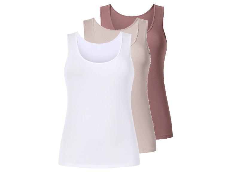 Drie dames tanktops in wit, beige en bruin, diagonaal gestapeld.