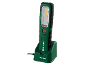 Oplaadbare LED-werklamp in een oplaadstation, groen en zwart.