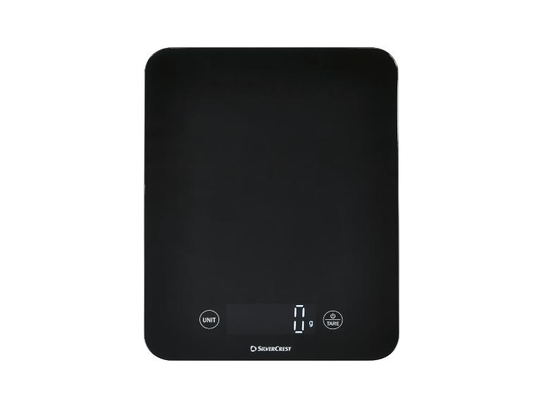 Zwarte digitale keukenweegschaal met display dat '0 g' toont en knoppen voor 'UNIT' en 'TARE'.