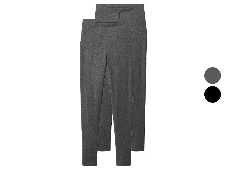 Twee paar donkergrijze en zwarte leggings, achter elkaar geplaatst.