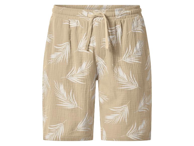 Beige mousseline shorts met witte bladprint en trekkoord.