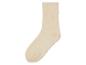Beige sokken met antislip stippen.