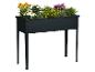 Zwarte rechthoekige verhoogde plantenbak met een assortiment kleurrijke bloemen