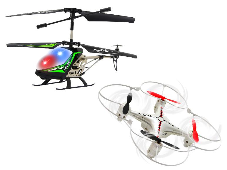 Een zwarte speelgoedhelikopter en een witte quadcopter met rode en zwarte propellers.