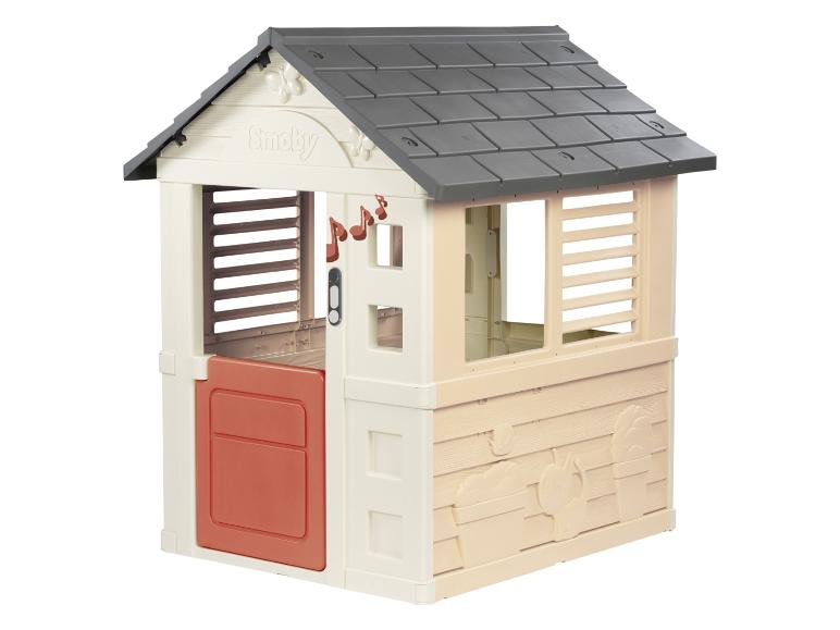 Beige en oranje kinder speelhuisje met een grijs dak en muzieknoten.