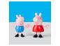 Twee Peppa Pig figuren, één in blauw en één in rood, houden elkaars hand vast.