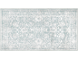 Rechthoekig vloerkleed met abstract bloemenpatroon en decoratieve rand, in blauwe en witte tinten.