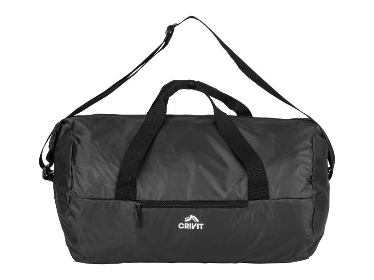 Zwarte, opvouwbare Crivit sporttas met schouderband.