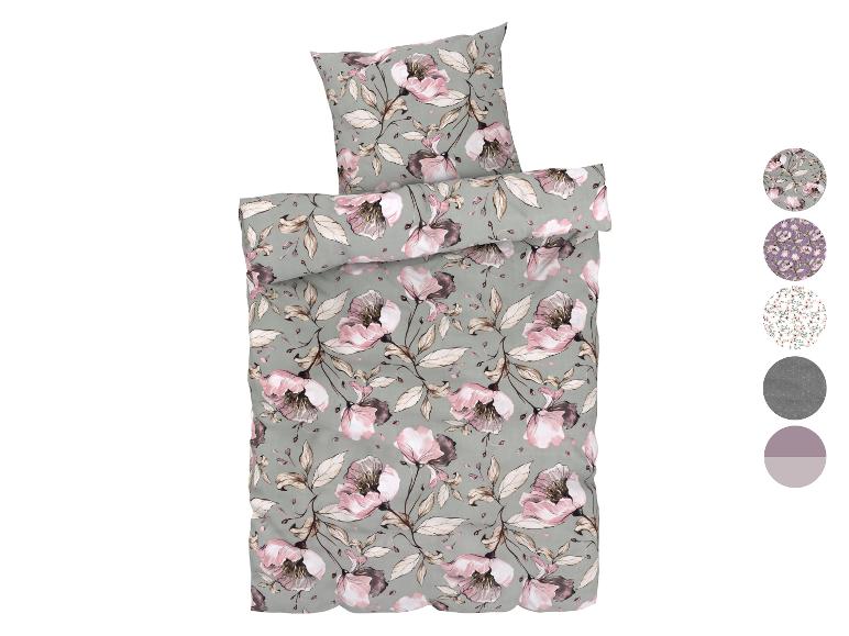Bloemen beddengoed in roze en grijze tinten.