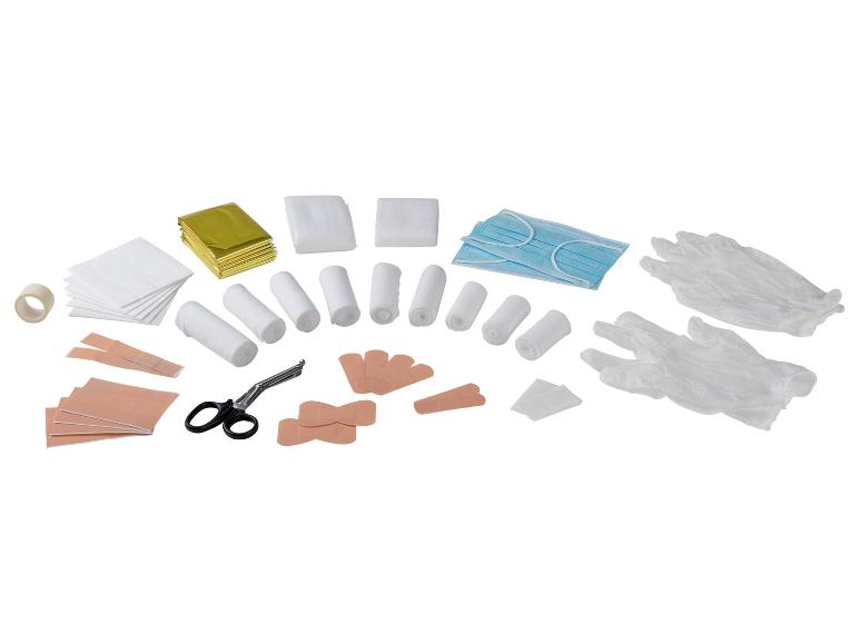EHBO-set met verbanden, pleisters, mondkapjes, handschoenen en schaar.